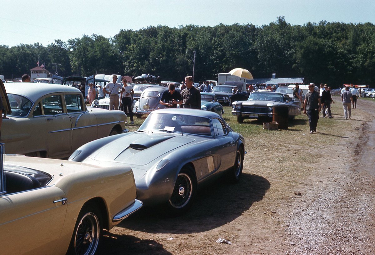 Sports cars and spectators at Elkhart Lake photographed in June 1961, a Ferrari in the foreground