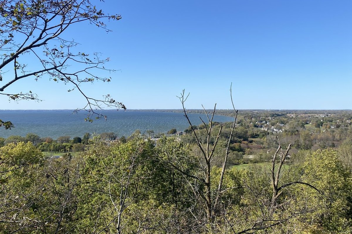 Lake Winnebago seen from the wooded top of the Niagara Escarpment at High Cliff State Park, water running to the horizon